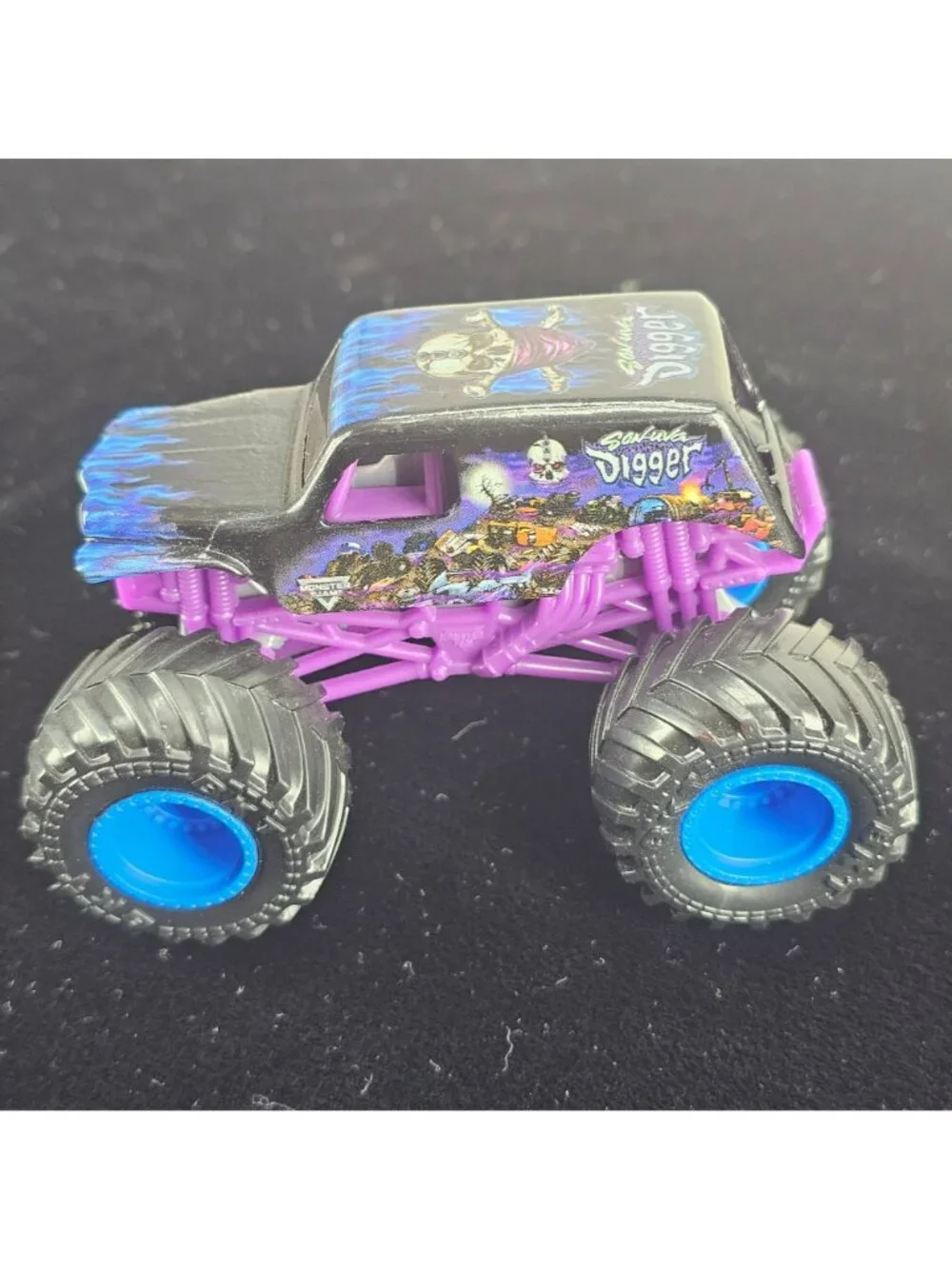 Grave Digger Monster Truck Toy Purple & Black 2024 Copyright Skeleton Design 4-W
